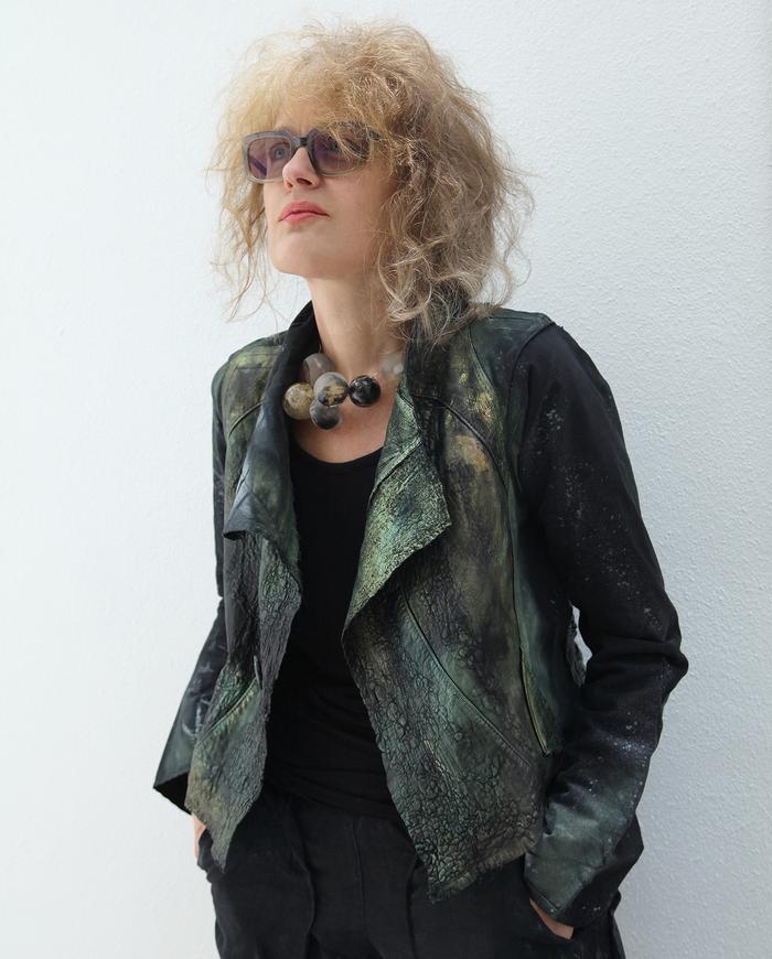 'full of surprised' mixed natural fabrics and leather short jacket